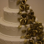 Chocolate Brownie with cascade of gold roses