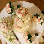 Vanilla sponge, chantilly cream, grand marnier syrup, raspberry jam and strawberries. Decorated with white chocolate shards and real flowers